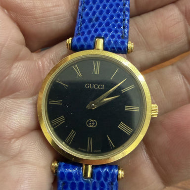 Gucci Watch - Blue Strap Gold-Tone Case Roman Numerals